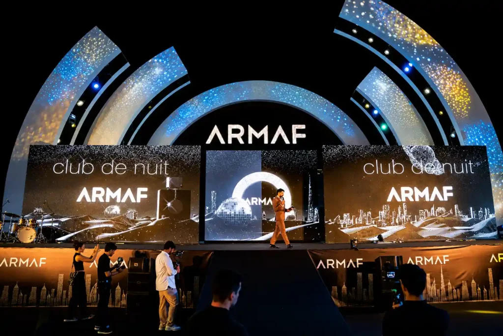 Luxury fragrance brand launch event featuring a professional event host, large LED screens, immersive stage design and experiential marketing activation in Dubai.