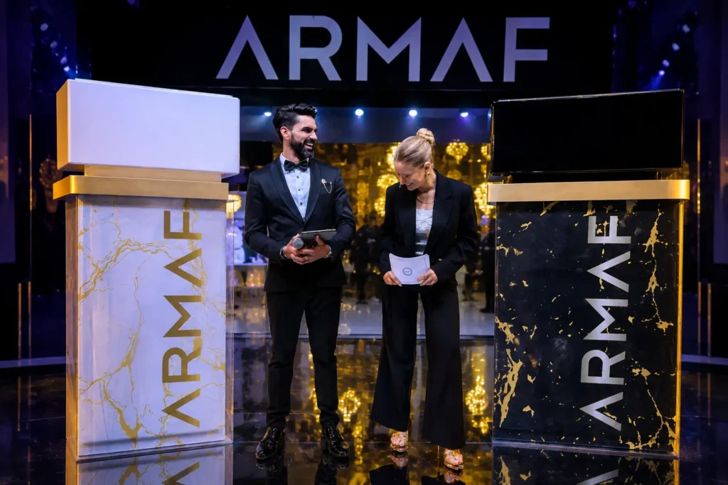 Guests laughing during a corporate event hosted by a professional MC